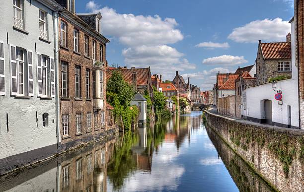 Canal in Bruges, Belgium Quiet canal in the old part of Bruges, Belgium brugge, belgium stock pictures, royalty-free photos & images