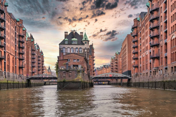 Canals and warehouses in Speicherstadt of Hamburg, Germany Canals and warehouses in Speicherstadt of Hamburg, Germany hamburg germany stock pictures, royalty-free photos & images