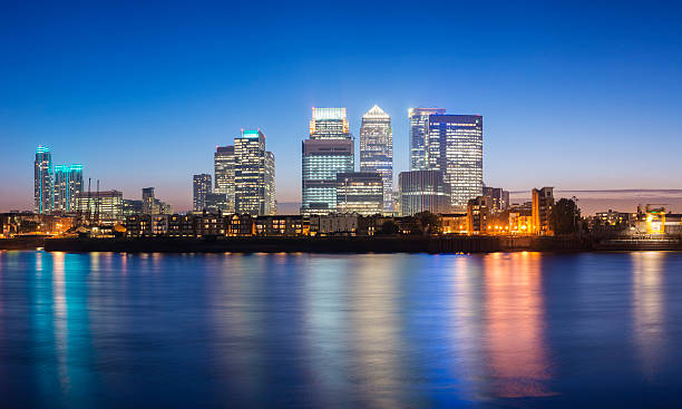 Canary Wharf London City Skyline at Night UK The skyline of Canary Wharf, London at sunset. canary wharf stock pictures, royalty-free photos & images