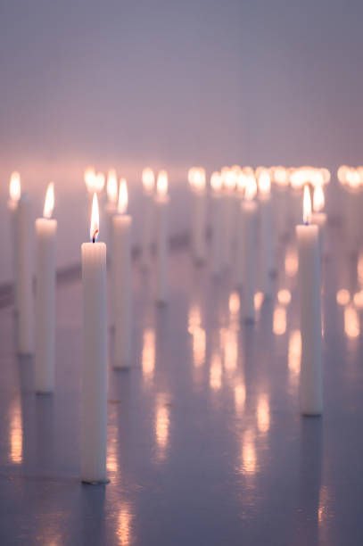 Candle Decorations A low angle image of a huge group of wax candles all lit up with selective foreground focus Cape Town South Africa memorial event stock pictures, royalty-free photos & images