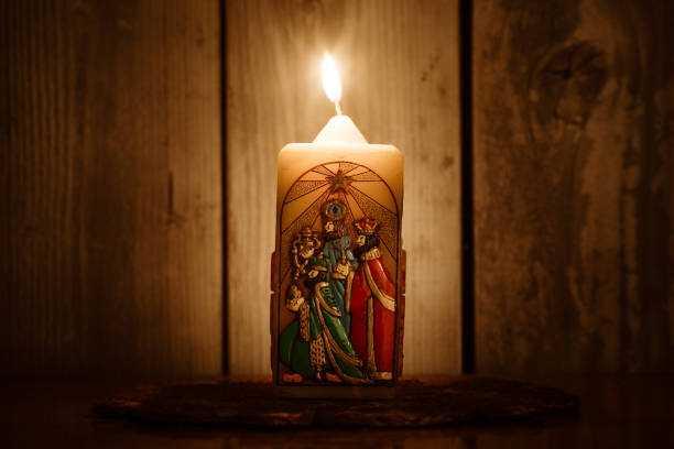 An old candle with a likeness of three wise men from the Christmas story, coming to visit the Christ child.  Part of the celebration of Epiphany in early December.