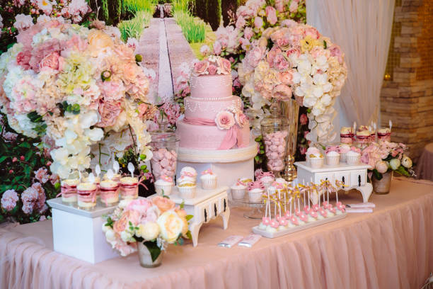 Candy bar and wedding cake. Table with sweets, buffet with cupcakes, candies, dessert. stock photo