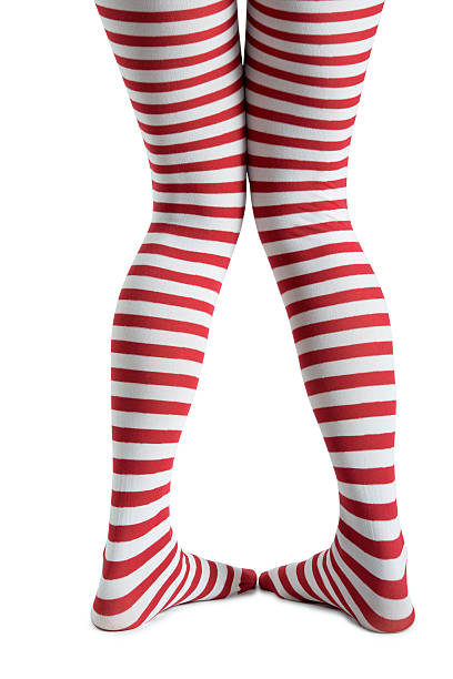 Candy Cane Legs Pigeon Toed Red and white striped legs with knees togetherRelated images: knobby knees stock pictures, royalty-free photos & images