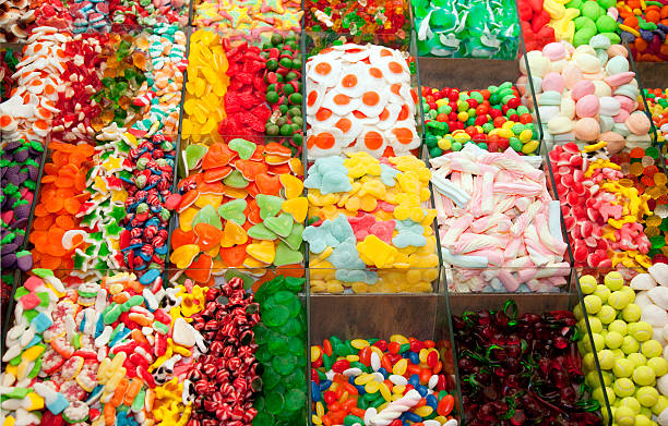 Candy store Variety of candys and gum drops at a market stall. candy store stock pictures, royalty-free photos & images