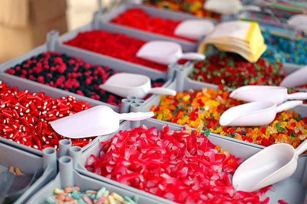 Candy Variety For Sale at the Market This is an image of a market stand of various types of sweets and candy in Genk, Belgium. Colorful gummy bears, jelly beans and gumdrops, as well as other types of candy are being sold here. pick and mix stock pictures, royalty-free photos & images