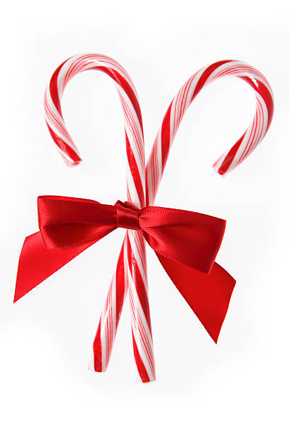 Candycanes with Red Bow (Isolated)  candy cane stock pictures, royalty-free photos & images