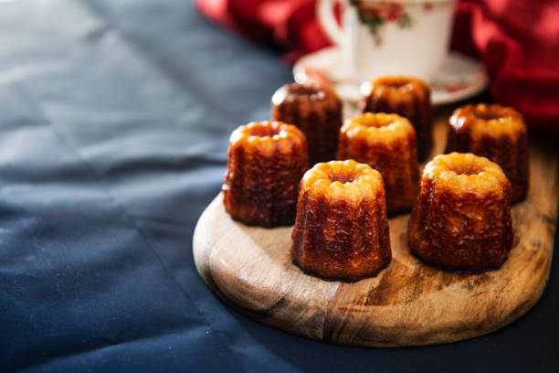 Canele is a small French pastry with rum and vanilla Canele is a small French pastry with rum and vanilla gironde photos stock pictures, royalty-free photos & images