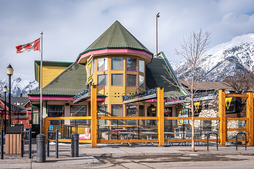 Canmore, Alberta - April 4, 2020: View of businesses in the mountain town of Canmore Alberta.  Canmore is a popular tourist destination close to Banff National Park.