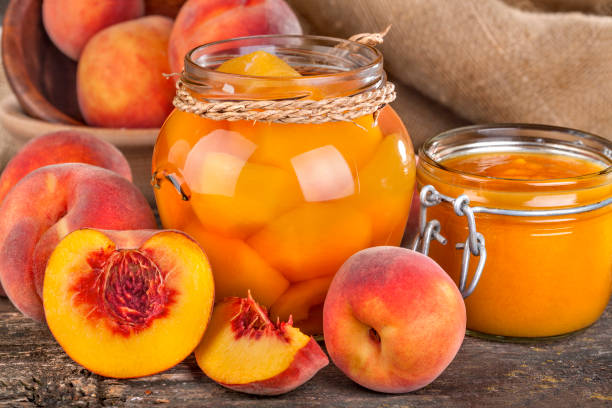 Canned compote with peaches stock photo