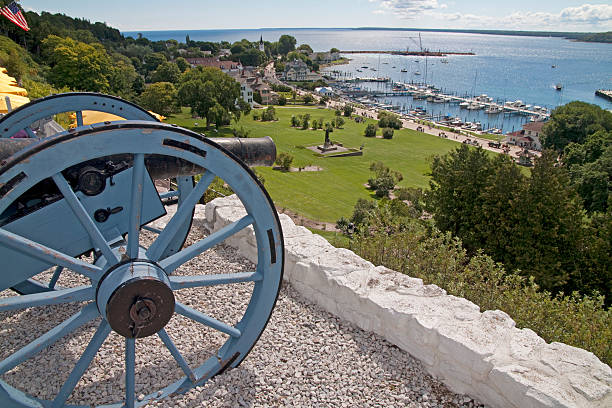 Cannon look out! Cannon close up in Fort Mackinac looking out toward Lake Huron Shoreline. mackinac island stock pictures, royalty-free photos & images