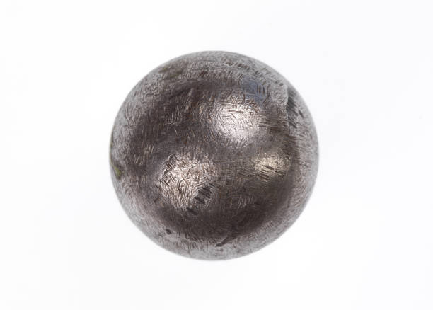 cannonball, iron ball isolated on white background cannonball, iron ball isolated on white background cannon artillery stock pictures, royalty-free photos & images