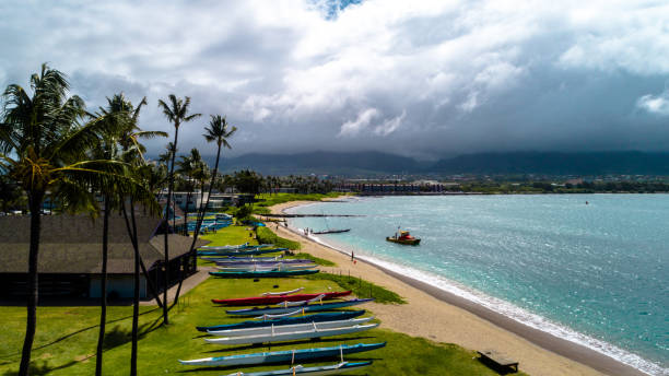 Canoes at the beach of Ho'aloha Park, Hawaii stock photo