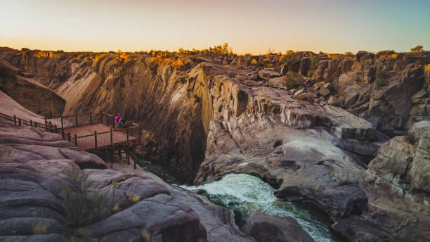 Canyon Look out point with tourist at Augrabies Waterfall Northern Cape at sunset stock photo