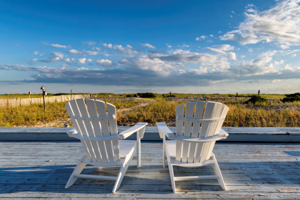 Cape Cod beach Beach chairs on Cape Cod beach at sunset cape cod stock pictures, royalty-free photos & images