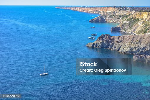 istock Cape Fiolent. Beautiful views of the Black Sea coast at Cape Fiolent in summer in clear weather. Aerial view to beautiful sea coast with turquoise water and rocks 1358220985