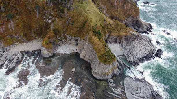 Cape Stolbchaty on the island of Kunashir, Kuril Islands, a unique geological volcanic formation included in the UNESCO list. stock photo