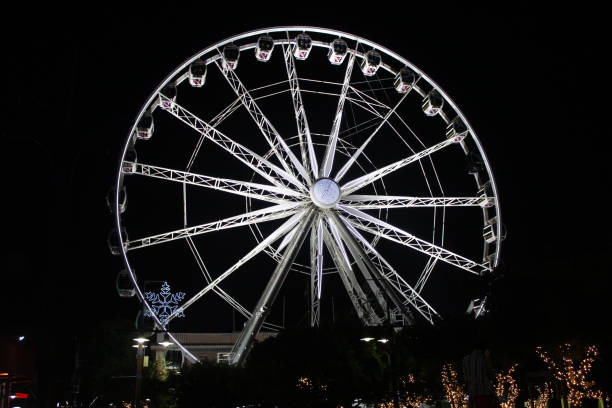Cape Wheel, a large observation Ferris wheel illuminated at night in the Victoria and Albert Waterfront, Cape Town, Western Cape, South Africa stock photo