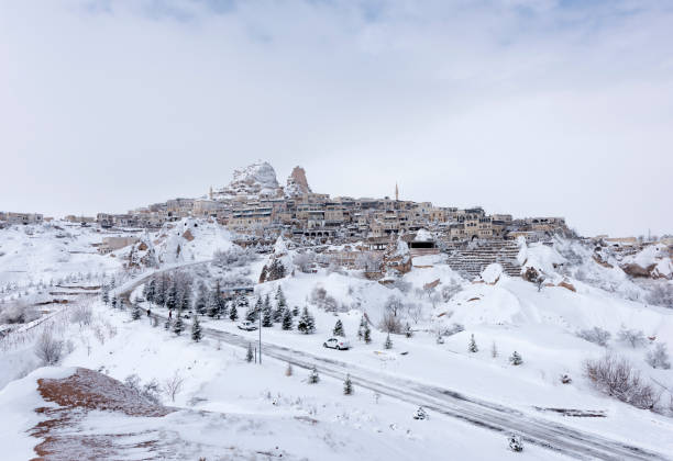 Cappadocia at winter Rock hoodoos ender Snow in Cappadocia, Turkey. rock hoodoo stock pictures, royalty-free photos & images