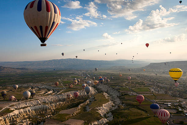 Cappadocia Hot air balloon over rock formations in Cappadocia, Turkey türkiye country stock pictures, royalty-free photos & images