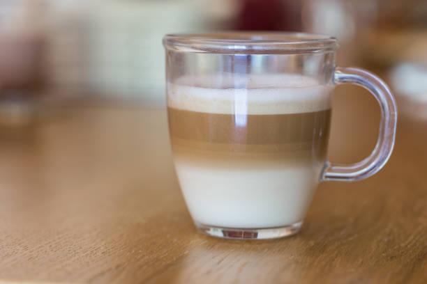 Cappuccino in clear glass stock photo