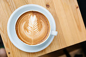 istock Cappuccino on a Wooden Table 624116496
