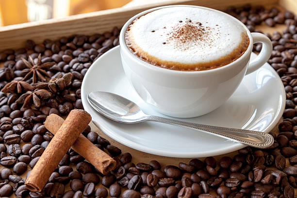 cappuccino with coffee beans stock photo