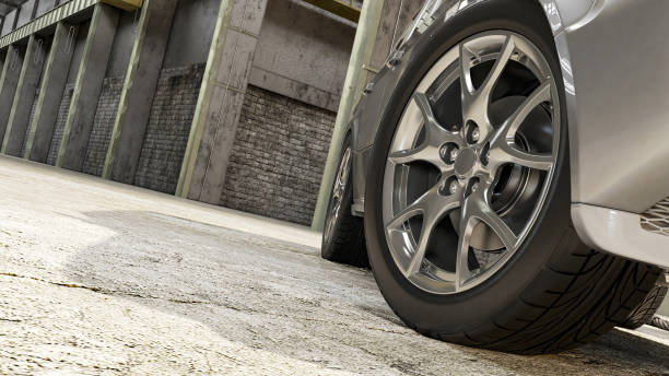 Car 3D is standing in a warehouse 3D rendering. Wheel close up. stock photo