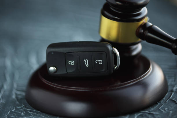Car auction concept - gavel and car key on the wooden car accident lawyer stock pictures, royalty-free photos & images
