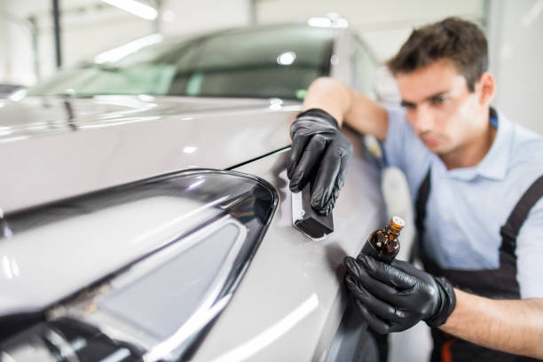 Car detailing concept. Auto cleaning and polish. Car detailing - Man applies nano protective coating to the car. Selective focus. ceramics stock pictures, royalty-free photos & images