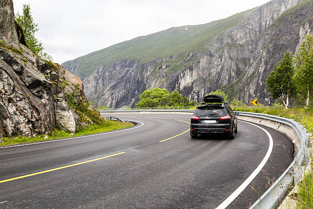Car driving on Hardangervidda road in Norway stock photo