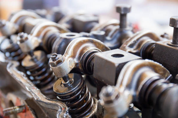 Car engine block camshaft and spring rocker arm valve, repairing and maintenance service concepts stock photo