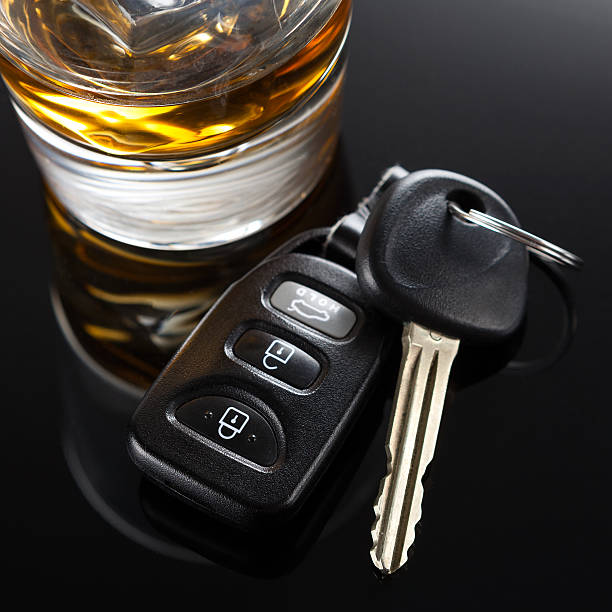 Car Keys and Alcoholic Drink Car Keys next to an alcoholic drink.  Please do not drink and drive bar drink establishment photos stock pictures, royalty-free photos & images