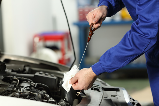 Car Mechanic Checking Oil Level Stock Photo Download Image Now iStock
