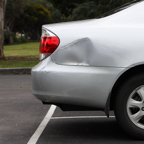 Car Park Accident Dent in the side of the car caused by a car park accident dented stock pictures, royalty-free photos & images