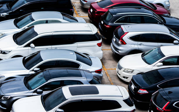 Car parked at parking lot of the airport for rental. Aerial view of car parking lot of the airport. Used luxury car for sale and rental service. Automobile parking space. Car dealership concept. stock photo