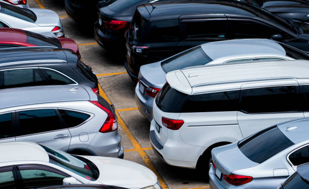 Car parked at the parking lot of the airport for rental. Aerial view of car parking lot of the airport. Used luxury car for sale and rental service. Automobile parking space. Car dealership concept. stock photo