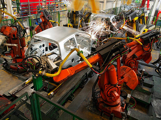 Car production Welding of car body shells on production line car plant stock pictures, royalty-free photos & images