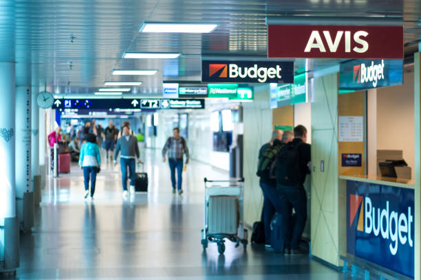 Car rental agencies in Helsinki Airport Vantaa, Finland June 12, 2019 - Car rental agencies in Helsinki Airport - Blurred people waitin on the the desk car rental stock pictures, royalty-free photos & images