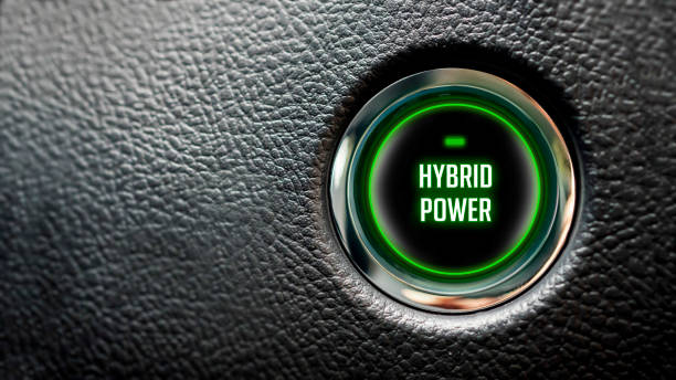 Car Start Button On Dashboard with hybrid power message stock photo