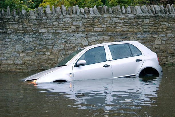 Car stuck in Rural flooding stock photo