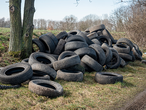 car tires illegally turfs away next to wheat field, Silesia, Poland