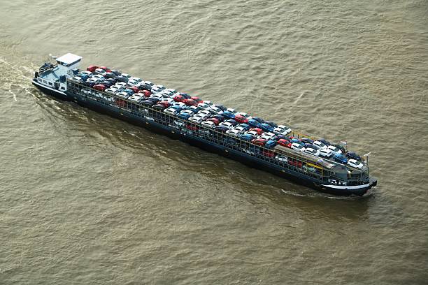Car transport with cargo ship on river Rhine, Düsseldorf Germany stock photo