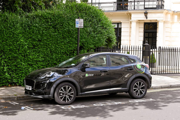 Car used in car sharing scheme operated by ZipCar London, England - August 2021: Zipcar parked on a street in central London. The cars, which are part of a car sharing scheme, are picked up and dropped off on the city's streets zipcar stock pictures, royalty-free photos & images