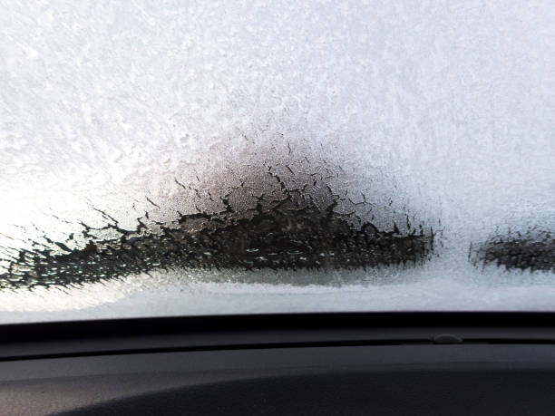 Car Windshield Defrosting Ice POV from Inside with Dash stock photo