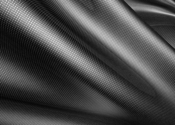A carbon fiber sheet, about to be molded  stock photo