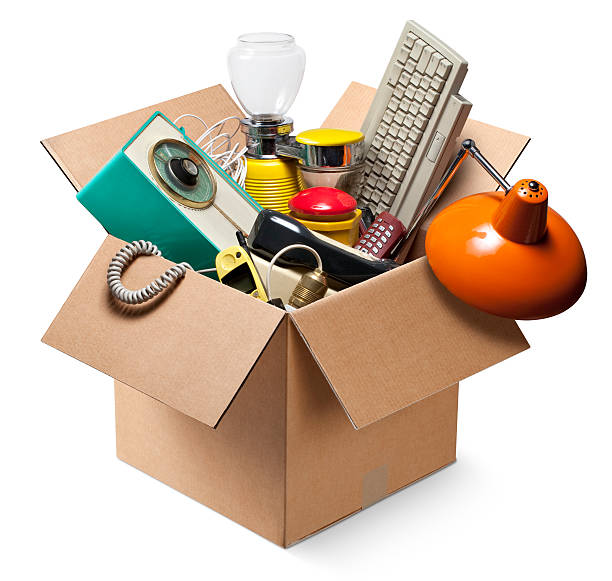 Cardboard box with old electrical appliances Moving house. Cardboard box with old electrical appliances.  manufactured object stock pictures, royalty-free photos & images