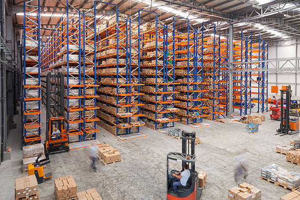Cardboard boxes on shelves in warehouse stock photo