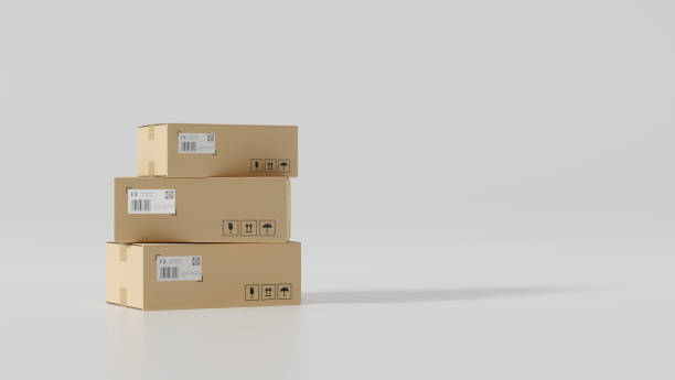 Cardboard boxes with fragile signs and copy space in white background stock photo