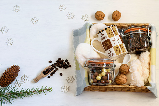 Gift box with coffee, coffee mug and treats
