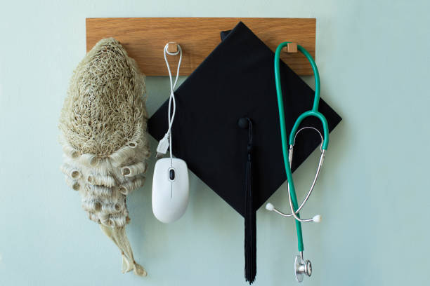 Career Concept With Tools Associated With Different Professions Hanging On Wall Rack Career Concept With Tools Associated With Different Professions Hanging On Wall Rack medical degrees online stock pictures, royalty-free photos & images